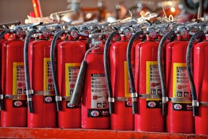 Commercial photography of row of fire extinguishers. These specialized industrial products were photographed on location in East Hanover, New Jersey